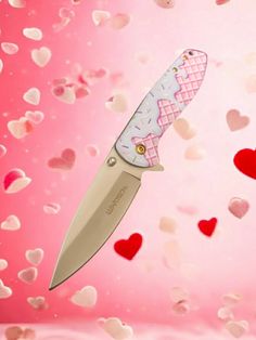 a knife with hearts floating around it on a pink background and the words hello kitty written in white