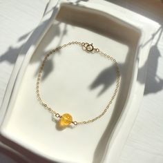 ✨ Delicate Single Amber Ball Bracelet with 14K Gold Filled, Rose Gold Filled or Sterling Silver. • Handmade with a genuine amber bead. Delicate & subtle bracelet that will match with any style, make a perfect gift & a treat for yourself 💚 📏 To find your bracelet size, measure your wrist and add 0.5 - 1 inch for room to wiggle (depending on your personal preference) • Gold Filled & Sterling Silver is known for its lasting quality. With proper care, this piece will last for a lifetime. It is non Gold Pearl Ring, Rose Gold Pearl, Crystal Healing Bracelets, Amber Bracelet, Ball Bracelet, Amber Beads, Bridal Bracelet, Amber Jewelry, Layered Bracelets