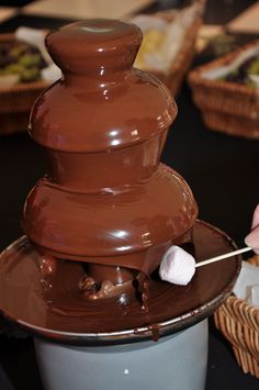 a chocolate fountain with marshmallows in it