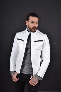 Leather jacket for men. soft light weight. Slim fit. Stand up collar. Chest and front zip pockets. Zips on the cuffs. White Urban Biker Jacket For Winter, Urban White Biker Jacket With Long Sleeves, White Urban Biker Jacket With Long Sleeves, Urban White Winter Biker Jacket, White Urban Winter Biker Jacket, Urban White Long Sleeve Biker Jacket, Casual White Leather Jacket With Zipper Closure, Casual White Leather Jacket With Zipper, White Moto Outerwear With Long Sleeves