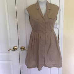 This Dress Is Has Collar Neck, Sleeveless, Modern Fit, Flap Pocket At The Front, Button Down Pleated Skirt Dress, Unlined With Belt. Color Dark Dune Sleeveless Belted Shirt Dress For Work, Sleeveless Belted Shirt Dress For Summer, Sleeveless Shirt Dress With Button Closure For Work, Casual Belted Sleeveless Summer Dress, Casual Belted Sleeveless Dress For Summer, Sleeveless Summer Shirt Dress With Pockets, Chic Sleeveless Belted Shirt Dress, Sleeveless Shirt Dress With Pockets For Daywear, Casual Belted Sleeveless Dress For Spring