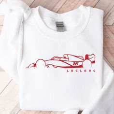 "Charles Leclerc F1 Crewneck Sweatshirt | Ferrari Formula 1 Crewneck | Charles Leclerc F1 Hoodie | Formula 1 Apparel | F1 Gift Unisex ORDERING: 1. Review all photos 2. Choose Size and Color from drop-down menu 3. If personalization box is available, add your text color 4. Add each shirt to cart one at a time 5. Click \"Add to Cart\" - you can go back to add more products 6. Click \"Proceed to Checkout\" 7. Add note to seller for any requests BULK DISCOUNTS AND SPECIAL REQUESTS: We offer bulk discounts and are open to special requests. Please feel free to direct message us with any inquiries. CARE INSTRUCTIONS: Wash inside out, gentle cycle, cold water, tumble dry low, medium iron. PRODUCTION AND SHIPPING: Processing time is next day. First Class Shipping is 2-5 business days (after process F1 Hoodie, F1 Merch, Ferrari Formula 1, Cycling Apparel, Digital Printer, Charles Leclerc, Embroidered Hoodie, Personalized Embroidered, Hoodie Design