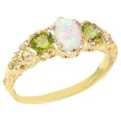 three stone ring in yellow gold with white opal and green tourmaline stones