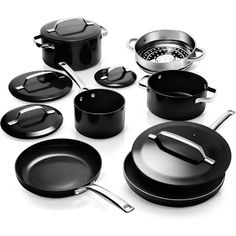 an assortment of black pots and pans