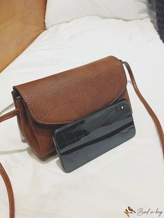 Casual Brown Crossbody Saddle Bag, Casual Brown Flap Bag For Everyday, Casual Saddle Shoulder Bag With Mobile Phone Pocket, Casual Saddle Shoulder Bag With Mobile Phone Bag, Casual Saddle Shoulder Bag With Phone Holder, Casual Shoulder Saddle Bag With Mobile Phone Holder, Casual Brown Saddle Bag With Detachable Strap, Casual Shoulder Flap Bag For Shopping, Casual Crossbody Flap Bag With Mobile Phone Pocket