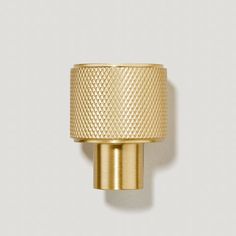 an image of a gold knob on the wall