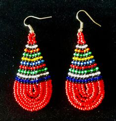 Ethnic Zulu Beadwork.  Tear drop snapped available in a variety of different colour combinations  Weight:  7g Length:  6.5cm Width:   2.5cm Artisan Multicolor Round Beaded Earrings, Traditional Large Beads Earrings, Multicolor Teardrop Jewelry With Colorful Beads, Multicolor Teardrop Jewelry For Festivals, Artisan Red Teardrop Earrings, Teardrop Multicolor Jewelry For Festivals, Fair Trade Beaded Dangle Earrings, Traditional Tiny Beads Earrings, Handmade Multicolor Bohemian Teardrop Earrings