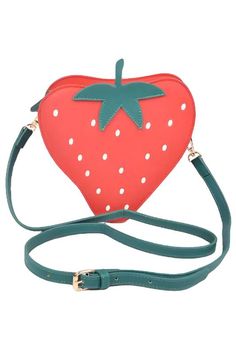 This iconic strawberry swing bag is a fun, fruit-shaped crossbody perfect for casual outings. Featuring a vibrant red design, a secure zip closure, and an adjustable strap, it adds a playful touch to any outfit. Compact yet roomy for your essentials, it's the perfect everyday statement bag. Crossbody Bag Strawberry Shape Design Removable Adjustable Strap Measurements: 7.5" x 7.5" x 2.5" Material Composition: Polyurethane Lead & Nickel Compliant Fruit Fashion, Fun Fruit, Headband Tiara, Statement Bag, Cute Fruit, Red Design, Pink Ribbon, Shape Design, Vibrant Red