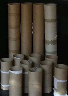 several rolls of toilet paper are stacked on top of each other