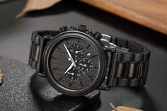 "Wood Watch Anniversary gift for man, Man Anniversary Gift, Personalized Wood Watch Man, Engraved Watch Groom Gift This chronograph watch is simple and masculine. Engineered from black stainless steel and detailed with zebrawood inlay, it is the perfect piece for any occasion. Watch Highlights -Black stainless steel band -Ebony wood inlay - Genuine high-quality Japanese quartz movement - Adjustable band with removable links - Watch cushion and gift box included - Free watch tool included Watch D Graduation Gift For Him, Personalized Watch, Engraved Watch, Graduation Gifts For Him, High School Graduation Gifts, Personalized Watches, Watch Engraving, Mens Anniversary Gifts, Wood Inlay