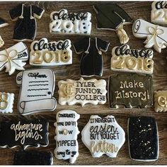 decorated cookies are arranged on a table for the graduation party to be held by friends and family