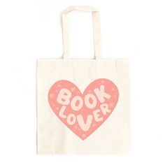 a white bag with pink heart and the words book lover printed on it, against a white background