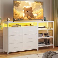 there is a large television on the wall in the room with many drawers and shelves