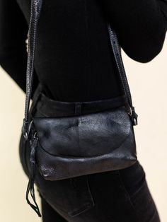 This small crossbody bag features an adjustable strap to allow versatility in styling. A fold over flap hides a zippered closure to keep all of your necessities safe and sound! Measures approx. 7 1/2" L x 4 1/2" H Black Adjustable Crossbody Shoulder Bag, Adjustable Black Crossbody Shoulder Bag, Black Crossbody Saddle Bag For Everyday Use, Black Shoulder Bag With Removable Pouch, Black Shoulder Bag With Removable Pouch And Adjustable Strap, Black Crossbody Saddle Bag, Black Crossbody Flap Bag With Adjustable Strap, Versatile Fall Flap Bag With Adjustable Strap, Versatile Flap Bag With Adjustable Strap For Fall