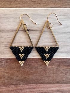 Black and Gold Woven Beaded Earrings on Brass Triangle 6.5 Cm Long approx. 2.5 In. Miyuki Japanese Glass Delica Beads - Etsy Bead Weaving Earrings, Adjustable Gold Beaded Earrings With Black Beads, Elegant Black Beaded Earrings With Tiny Beads, Elegant Black Earrings With Tiny Beads, Black Beaded Drop Earrings With Gold Beads, Black Bohemian Beaded Earrings With Gold Beads, Black And Gold Beaded Drop Earrings, Black Earrings With Handwoven Round Beads, Black Handwoven Earrings With Round Beads