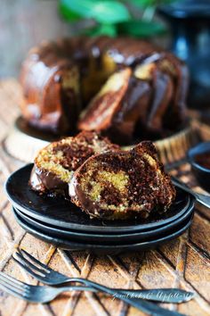 a chocolate bundt cake on a black plate