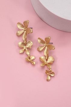 Beautiful earrings that make a statement! Perfect for your next vacation! Matte finish lightweight 2" long Gold Earrings For Beach Spring Season, Spring Vacation Dangle Jewelry, Gold Flower-shaped Earrings For Beach, Gold Flower Earrings For Beach, Elegant Earrings For Vacation In Spring, Trendy Flower Shaped Jewelry For Vacation, Trendy Flower Jewelry For Vacation, Trendy Flower-shaped Jewelry For Vacation, Trendy Flower-shaped Vacation Jewelry