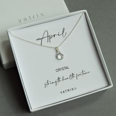 "A dainty birthstone necklace for April. This simple, yet elegant April birthstone necklace is made from sterling silver. The April birthstone charm sits on a belcher chain. It can be personalised with an initial charm. The birthstone necklace sits on a sentiment card reading: April Crystal Strength, Health, Fortune A fabulous gift for a friend or family member. Great for older children or adults alike. The birthstone necklace comes in a Yatris gift box, all ready to give the recipient. © Y A T April Crystal, April Birthstone Necklace, Belcher Chain, April Birthstone, Letter Charms, Birthstone Charms, Gorgeous Bracelet, Card Reading, Initial Charm