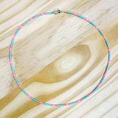 Approximately 15 inches long Made with seed beads on silver wire to prevent wear Spring ring closure stackable and dainty Bead Necklace Ideas Aesthetic, Adjustable Dainty Beaded Necklace With Spacer Beads, Dainty Adjustable Bracelet With Tiny Beads, Dainty Heishi Bead Jewelry With Colorful Beads, Minimalist Adjustable Silver Beaded Necklaces, Adjustable Pink Beaded Necklaces With Silver Beads, Adjustable Pink Beaded Necklace With Silver Beads, Dainty Beaded Necklace With Tiny Beads For Festivals, Dainty Adjustable Beaded Chain Necklaces