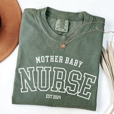 Discover the perfect way to show appreciation and support with our Comfort Colors Mother Baby Unit Nurse T-shirt. This stylish and comfortable tee is an ideal gift for MBU nurses, nursing school graduates, and members of the Baby Team. Celebrate the dedication of these incredible professionals with a thoughtful and practical nurse appreciation gift. Comfort Colors introduces the "Comfort Colors 1717" garment-dyed t-shirt; a fully customizable tee made 100% with ring-spun cotton. The soft-washed, School Spirit Cotton T-shirt As Gift, School Spirit T-shirt With Letter Print As Gift, Nursing Cotton T-shirt With Letter Print, School Spirit Cotton T-shirt For Gift, Cotton School Spirit T-shirt As Gift, Cotton Nursing Graphic Tee, Cotton Graphic Tee For Nursing, Personalized School Spirit T-shirt With Crew Neck, Cotton Nursing Friendly T-shirt