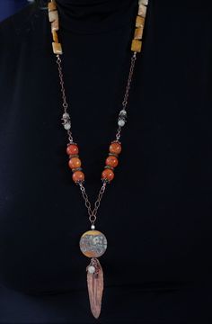 "A lovely combination of agate and quartz gemstones, antique copper chain, handmade copper components and clasp, and accented with my handmade lampwork glass beads, wire wrapped with a hand formed folded copper leaf, made by moi, and little gemstones. This super long, one of a kind lampwork necklace measures 33\" with a 5\" pendant and will arrive beautifully packaged. Sure to garner lots of compliments! To view more jewelry and handmade beads, click here... https://www.etsy.com/shop/StoneDesign Bohemian Beaded Necklace With Natural Stones And Copper, Bohemian Beaded Necklaces With Natural Stones And Copper, Copper Beaded Chain Jewelry Gift, Bohemian Brown Necklace With Copper Wire, Copper Beaded Chain Jewelry For Gifts, Copper Beaded Chain Jewelry As Gift, Bohemian Brown Copper Wire Necklace, Bohemian Wire Wrapped Copper Wire Necklaces, Artisan Copper Necklaces With Gemstone Beads