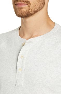 Casual, comfortable and easy to wear, this supersoft henley is cut from a stretch-cotton blend and styled with roomy raglan sleeves. Button half-placket Crewneck Long sleeves 58% cotton, 39% polyester, 3% spandex Machine wash, tumble dry Imported Casual Relaxed Fit Henley With Buttons, Everyday Cotton Crew Neck Henley, White Cotton Henley With Buttons, White Cotton Henley With Henley Neckline, Casual Everyday Henley With Buttons, Casual Everyday Henley, Relaxed Fit Crew Neck Henley With Buttons, Relaxed Fit Henley With Buttons And Crew Neck, Casual Henley With Buttons And Crew Neck