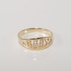 "Thanks for shopping our vintage estate store. We tend to sell well below wholesale and truly hope you enjoy all of our items. Many of the items are one of a kind, so please enjoy scrolling through the pictures and hopefully something will catch your eye. Spots are from camera or reflections. Estate 14k yellow gold baby ring. Spelled baby in block style. Ring size: 1.5 Setting: 1/4\" 5mm Band width: 1.7mm Weight: .87 gram Sweet ring, marked 14k." Personalized Engraved Yellow Gold Ring For Collectors, Vintage Engraved Ring For Collectible, Vintage Personalized Engraved Ring For Collectors, Personalized Antique 14k Gold Rings, Classic Gold Engraved Ring With Custom Name, Classic Gold Rings With Custom Name, Vintage Ring For Birthday, Personalized Vintage 14k Gold Rings, Classic Yellow Gold Engraved Ring With Custom Name