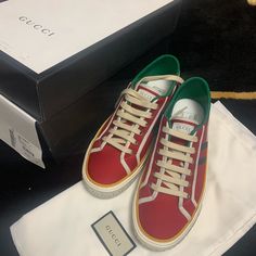 Gucci Mens Red Tennis 1977 Sneaker 606111 Condition Is Brand New With Box Dust Bags And Extra Laces. Come With Dust Bags And Auth Card 100% Authentic And Will Be Shipped Gucci Leather High-top Sneakers With Embroidered Logo, Gucci Red High-top Sneakers, Red High-top Gucci Sneakers, Gucci Designer High-top Sneakers With Embroidered Logo, Designer Gucci High-top Sneakers With Embroidered Logo, Gucci Sporty High-top Sneakers With Embroidered Logo, Gucci High-top Sneakers With Embroidered Logo, Gucci High-top Sneakers With Vulcanized Sole, Gucci Vulcanized Sole Sneakers For Streetwear