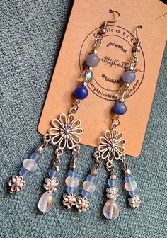 Blue & silver daisy floral earrings, featuring polished blue aventurine, quartz, glass, & silvertone lead-free metal alloy beads. ✨️ Silver Flower Dangle Earrings With Beads, Blue Aventurine, Floral Earrings, Blue And Silver, Jewelry Earrings Dangle, Etsy Earrings, Dangle Drop Earrings, Silver Tone, Daisy