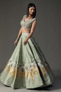 Sea green structured cape with feather, floral applique embroidery and sequin work on scallop border. Paired with sequin, cutdana embroidered blouse. Comes with floral hand painted lehenga. - Aza Fashions Fitted Green Raw Silk Lehenga, Fitted Green Raw Silk Choli, Fitted Pista Green Raw Silk Dress, Fitted Pista Green Dress In Raw Silk, Ceremonial Fitted Lehenga, Ceremonial Fitted Choli, Fitted Floor-length Choli For Ceremonial Occasions, Ceremonial Lehenga With Fitted Unstitched Blouse, Ceremonial Fitted Lehenga With Unstitched Blouse