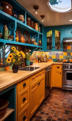 a kitchen with sunflowers on the counter and blue cabinets