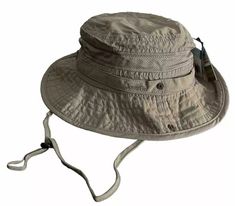 The Jungle Boonie Hat is the perfect choice for any outdoor activity. Not only does it offer protection against UV (UPF 50+) and water, it also provides excellent ventilation and moisture management with its mesh ventilation panel and moisture wicking sweatband. The branch loops and snap-up brim keeps the hat on your head comfortably no matter where you are. Made with 100% nylon. 100% Nylon UV Protection (ups 50+) Water Repellent Moisture Wicking Sweatband Branch Loops Snap-up Brim Mesh Ventilation Panel Adjustable Chin Cord Size: L-59cm XL-60cm 2XL-62cm Adjustable Fit Beige Hat For Outdoor, Outdoor Adjustable Fit Beige Hat, Outdoor Adjustable Beige Hat, Lightweight Casual Hat For Camping, Spring Sun Hat For Outdoor Activities In Khaki, Spring Khaki Sun Hat For Outdoor Activities, Khaki Outdoor Hat For Spring, Spring Camping Bucket Hat, Beige Cap Sun Hat For Outdoor