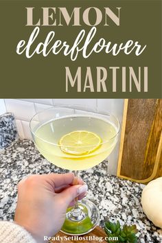 lemon elderflower martini in a coupe glass on a marble countertop with text overlay that reads, lemon elderflower martini