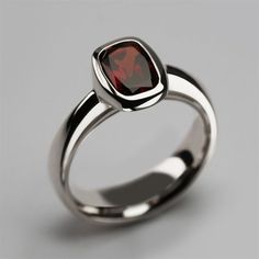 "Product description: Product Type - Ring Metal Type - 925 Sterling Silver (High Quality Polishing & Finishing) Gemstone - Natural Garnet Gemstone Size - 8X6 MM Gemstones Shape - Cushion Accent Stone - None Gemstone color - As Picture Gemstone Purity - 100% Natural (Guaranteed) Standard Shipping - 3 to 7 Days ($25 Extra) Economy Shipping - 10 to 20 Days (Free Worldwide) Please Note - Color in the picture may be slightly different from the actual product. Due to photographic light conditions. Classic Solitaire Gemstones For Formal Occasions, Classic White Gold Birthstone Ring With Polished Finish, Formal White Gold Ruby Ring With Polished Finish, Classic Solitaire Gemstones For Anniversary, Classic Ruby Ring With Polished Round Stone, Formal White Gold Birthstone Ring With Tension Setting, Elegant Birthstone Ring With Polished Finish For Anniversary, Formal White Gold Birthstone Ring With Polished Finish, Luxury Polished Gemstones For Anniversary