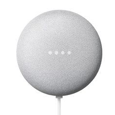 the google home speaker is connected to a white cord