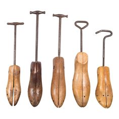 four different types of woodworking tools hanging from hooks