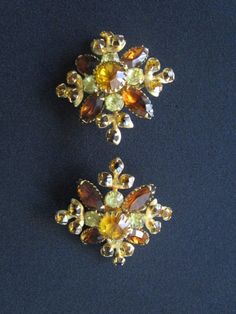 "Mesmerizing Vintage From Designer JUDY LEE Jewelry Navette or Marquise Round Cut Amber Citrine Colored Rhinestone With Frosted Glass and Aurora Borealis Crystal Rhinestone Filigree Gold Tone Floral Design Brooch and Earrings Measures brooch 2\" across and each earring 1-7/8\" across. each piece is signed Judy-Lee. Each piece is in very good vintage condition with minor signs of wear due to its age. Overall they're beautiful clean and ready to wear!. For more beautiful and fabulous of vintage je Yellow Brooch Jewelry For Wedding, Yellow Wedding Jewelry Brooch, Wedding Costume Jewelry Brooches With Matching Earrings, Orange Citrine, Aurora Borealis Crystal, Gold Chain Jewelry, Monogram Design, Chain Link Necklace, Aurora Borealis