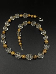 The Beautiful Crystals Quartz Beads Necklace Probably From Ancient Roman's or Greek's From Central Asian Countries Some Gold plated Wax and Some Brass Beads are Used As Spacers The Conditions Of Beads are Very Clearly Shown In the Pictures .Some Beads Got Some Damages that is due to Long Period Of times Price Is Negotiable So Please Do not Hesitate To Make an Offer Fast and Free Shipping Enjoy Beads Gold Crystal Necklaces With Faceted Beads For Wedding, Formal Beaded Crystal Necklace With Round Beads, Gold Crystal Necklace With Large Round Beads, Vintage Gold Beaded Crystal Necklaces, Vintage Gold Crystal Necklace With Faceted Beads, Formal Gold Faceted Beads, Antique Agate Beads With Large Beads, Vintage Polished Gold Beads, Traditional Agate Large Beads