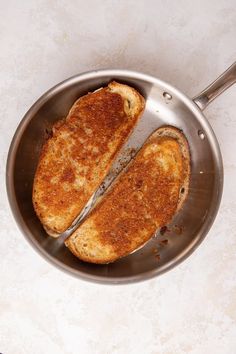 two pieces of toast in a frying pan