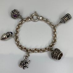 Heavy 925 Milor 7.5" Charm Bracelet Large Round Trigger Closure Includes Five Kabana Sterling Charms 1 - Bali Filigree Amethyst Citrine Egg - 5/8" X 5/8" 1 - Urn With Blue Topaz - 3/4" X 3/8" 1 - Carved Rose - 3/4" X 1/2" 1 - Marcasite Crown - 5/8" Diameter X 2/4"H 1 - Birdcase With Articulating Door/Gold Bird On Perch -3/4" X 1/2" 44g Total Weight Excellent Used Conditon Charms Are Attached By Kabana Signature "S" Hook More Charms Can Be Added Sterling Silver Charm Bracelet With Silver Clasp, Elegant White Gold Charm Bracelet Stamped 925, Elegant White Gold Sterling Silver Charm Bracelet, Rose Crown, S Hook, Womens Jewelry Bracelets, Blue Topaz, Citrine, Silver 925