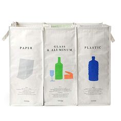 three bags with different types of paper and plastic bottles on the front one is white, the other is blue