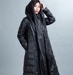 This down coat make with 90% duck down ,very warm in the winter .also have plus size to 10 XL.,please kind contact with me if you want a custom size This is a winter down jacket fill with down.we design it with a very thick and warm style.this hooded down jacket could keep you very warm in the cold winter.the side pockets is very useful.a unique design women winter coat. Material: 90% duck down ,polyester Style: Casual Package Contents: 1 x down coat Size: S:Length:115cm chest:104cm shoulder:40c