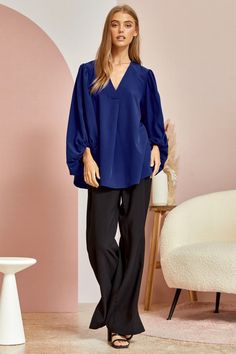 Blue is the color of the sky and sea, and in this blouse it’s the color of confidence. With a flowing silhouette and 3⁄4 sleeves that billow with carefree spirit, the Be Yourself top invites you to embrace your true self. Made for turning heads with every flutter of its fluid bodice, this ravishing royal blue top is a sartorial reminder that style knows no limits. Pair it with white denim for a nautical vibe or a boldly printed bottoms to really make a statement. However you style it, one thing’ Elegant Blue Blouse With Pleated Sleeves, Chic Blue Blouse With Gathered Sleeves, Versatile Blouse For Brunch, Elegant Blue Blouse With Gathered Sleeves, Chic Blue Lantern Sleeve Blouse, Versatile Blue Blouse For Work, Versatile Blue Blouse For Workwear, Chic Blue Tops With Pleated Sleeves, Chic Oversized Blue Blouse