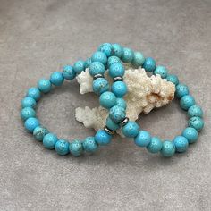 Step into a world of serene beauty with our Elegant Turquoise Stretch Bracelet. This exquisite piece is carefully handcrafted, featuring genuine turquoise beads in a mesmerizing shade of blue that evokes the tranquility of the sea and the vastness of the sky. Each bead is a testament to the timeless allure of turquoise, a stone cherished through centuries for its unique hue and spiritual significance. Turquoise 8mm Sterling Silver spacers Genuine Turquoise, Blue Turquoise, Turquoise Beads, Stretch Bracelet, Turquoise Blue, Stretch Bracelets, Shades Of Blue, The Sky, Turquoise Bracelet