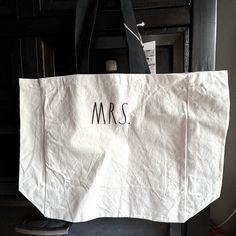 a white bag with the word mrs written on it