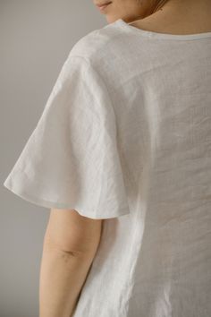 Tina - plus size short sleeve white linen blouse for summer Qualities of this oversized linen V-neck T-shirt: ♥ 100 % European linen ♥ Butterfly sleeves ♥ Natural wrinkles ♥ Not ironed (and no need to iron to have a relaxed look) ♥ Custom measurements can be applied ♥ 25 COLORS to choose The fabric is certified 100% European linen. This guarantees that it meets human - ecological requirements. Linen is a natural, comfortable and breathable fabric that grows softer with age. The linen we use for Casual Linen Dress With Short Sleeves, Casual Short Sleeve Linen Dress, Effortless Short Sleeve Tops For Vacation, Short Sleeve Linen Dress For Vacation, Summer Linen Dress With Relaxed Fit And Short Sleeves, Summer Linen Dress With Short Sleeves And Relaxed Fit, Vacation Linen Dress With Short Sleeves And Relaxed Fit, Relaxed Fit Linen Summer Dress With Short Sleeves, Relaxed Fit Short Sleeve Linen Summer Dress