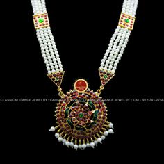 Original Design by Classical Dance Jewelry® ❥ Pearl Kempu moti mala Long Haram Chain is traditional and ethnic South Asian Indian Jewelry. ❥ Traditional Padakkam Peacock Style Pendant Pearls Kempu and white stone Long Necklace ❥ You Can wear this set for Bharatnatyam Kuchipudi Dance Performances, Engagement, Weddings, Birthdays, festivals, puja, Ammavaru Amman decorations, Durgamata Decoration ❥ Handmade Indian Traditional Item. ❥❥❥ Set has variations please CHECKOUT Variants ☛ Long Necklace wit Kundan Necklace With Tilla For Puja, Kundan Necklace With Zari Work For Puja And Navratri, White Cutdana Jewelry For Traditional Ceremonies, Traditional Necklaces For Festivals And Ceremonies, Traditional Ceremony White Cutdana Jewelry, Traditional Kundan Necklace With Zari Work For Puja, Kundan Meenakari Necklace For Traditional Ceremonies, Kundan Necklace With Meenakari For Traditional Festivals, Kundan Necklace With Meenakari For Traditional Ceremonies