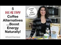 a woman standing in front of a counter with coffee