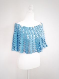 Wear this unique hand crochet boho cape in sky blue and conquer your friends and loved ones with your sophistication, audacity and imagination on Mother's Day or a wedding day.Fits sizes XS-XL.Dimensions: approximately 14 inch (36 cm) long. The model on the picture is 5'10" tall (175 cm).Materials: acrylic yarn, fabric flowers, beads.Color: sky blue.Care: hand wash in lukewarm water with mild detergent. Lay flat to dry in desired shape. Do not twist, rub or stress the yarn in other ways. Note: c Caplet Pattern, Crochet Caplet, Boho Cape, Wedding Crochet, Te Fiti, Shawl White, Day Fits, Flowers Beads, Shrugs And Boleros