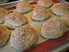 bread rolls on a baking sheet ready to go into the oven for cooking in the oven